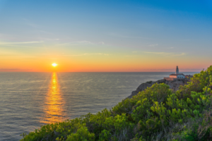 sunset ocean lighthouse